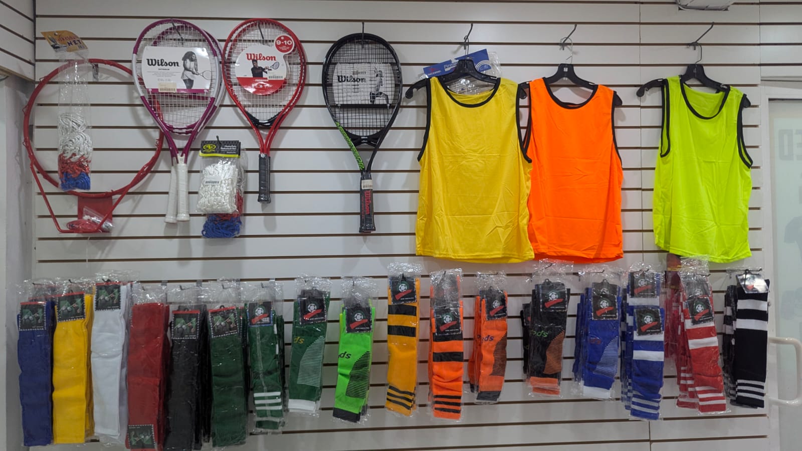 Sporting goods including rackets, jerseys and socks