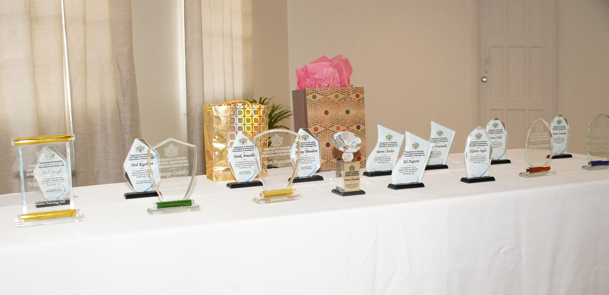 Awards ceremony table set with trophies